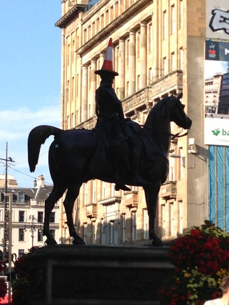 Glasgow 2013 - Why do all the statues have witches hats on their heads? 